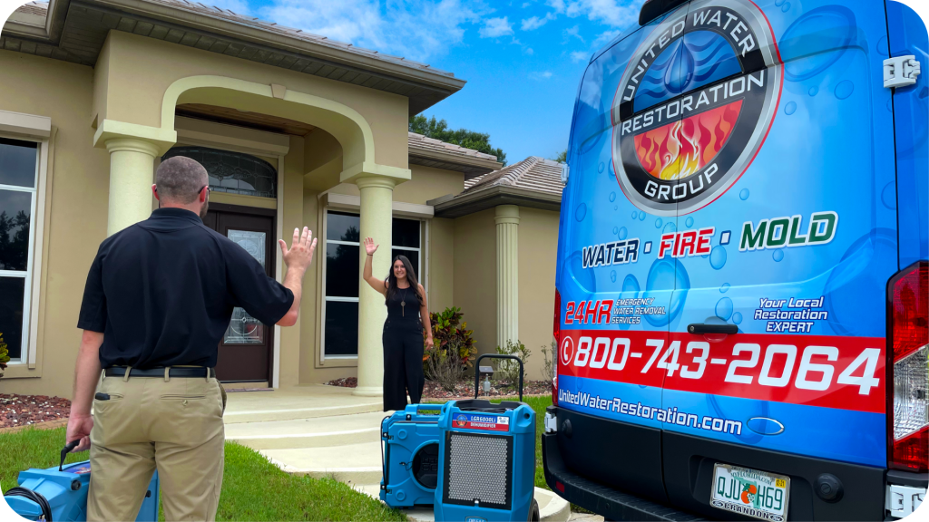 United-water-restoration-technician-greets-customer-daytona-beach