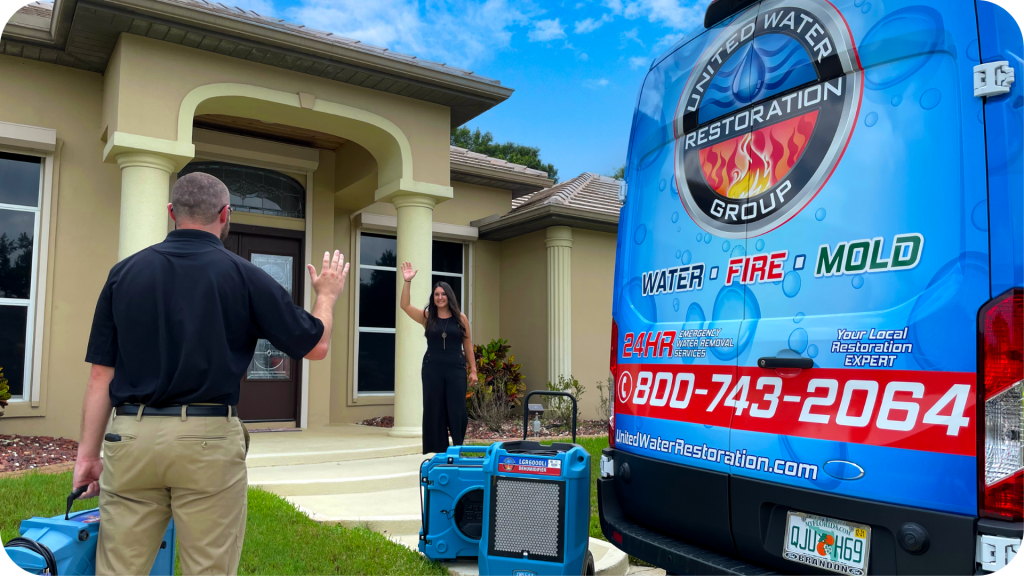 United-water-restoration-technician-greets-customer