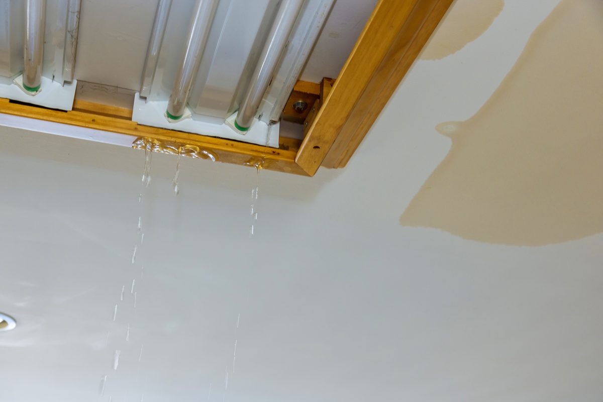 Water dripping from a ceiling due to a leak