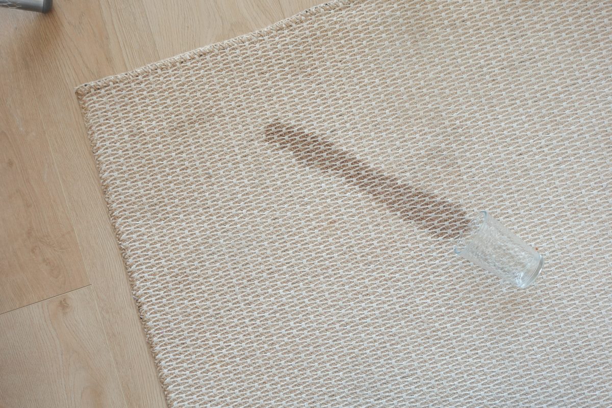 Water spilled and soaking into carpet